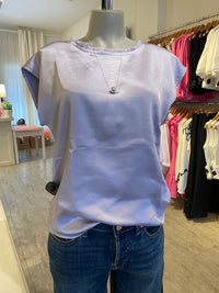 Melissa Nepton satin crew neck top by Melissa Nepton on display inside Lemonberry in Aurora Ontario.