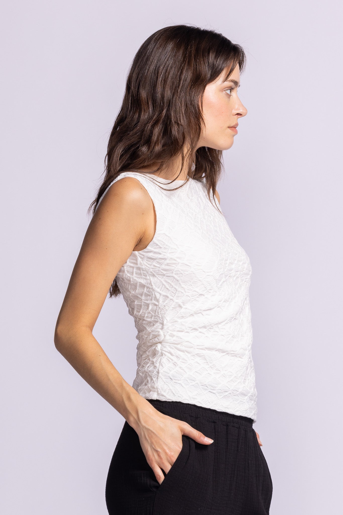Side view of the Annika Top by Pink Martini in white – comfortable fit with side rouching design. Shop locally at Lemonberry, Aurora, ON.