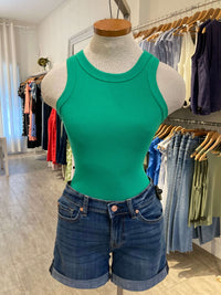 Green Danika tank on mannequin paired with denim shorts in Lemonberry boutique