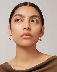 Jenny Bird Colette Hoop Small in gold — front view on model, Lemonberry Aurora.