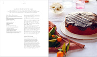 Open spread from Love, Pamela cookbook featuring the La Vie En Rose olive oil cake recipe with a beautifully plated slice.