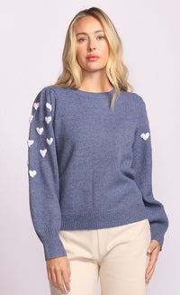 close-up of heart embroidery on Revello Sweater, soft knit recycled fabric