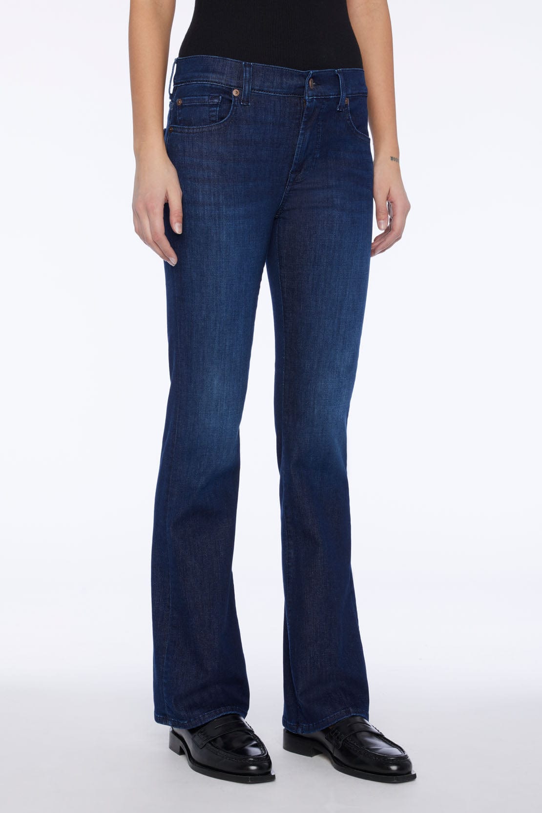 Front view of 7 For All Mankind Bootcut Tailorless jeans in Afternoon wash with mid-rise bootcut fit.