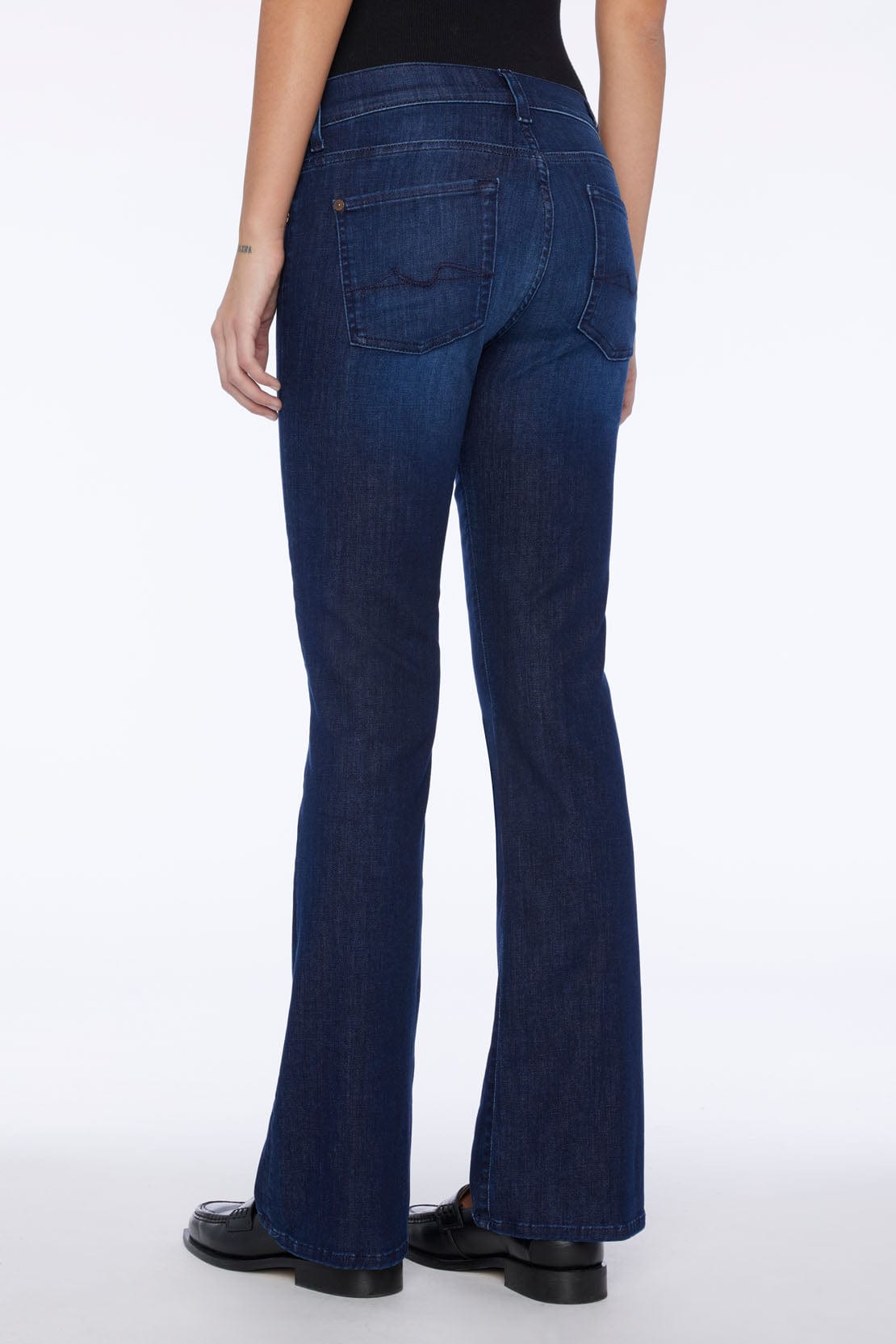Back view of 7 For All Mankind Bootcut Tailorless jeans in Afternoon wash, mid-rise bootcut silhouette.