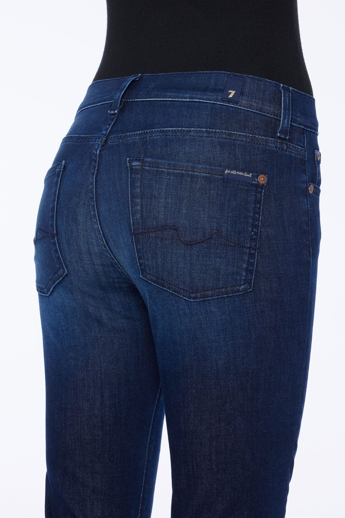 Close-up of pocket detail on 7 For All Mankind Bootcut Tailorless jeans in Afternoon wash.

