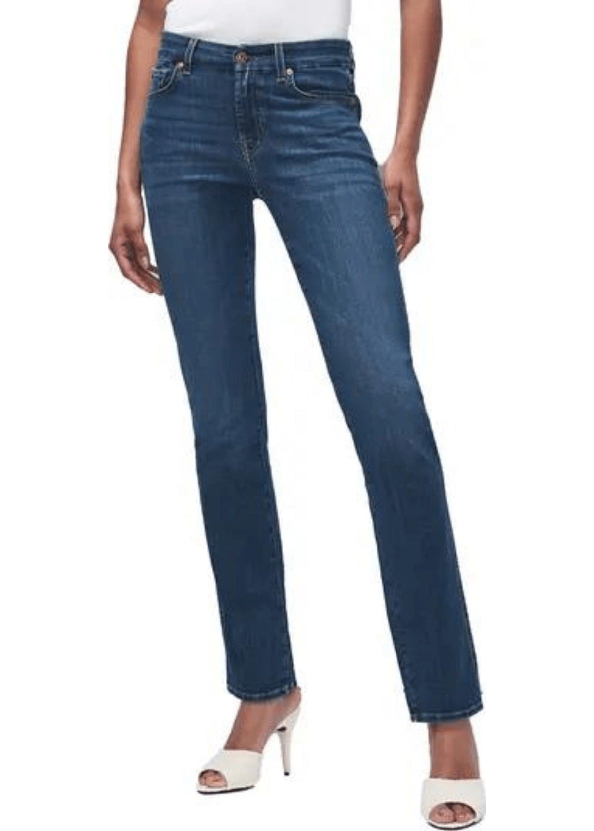 Side angle of Kimmie Straight Indigo Rinse Jeans by 7 For All Mankind, styled with black heels