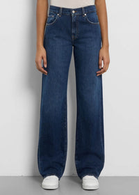 Tess trouser by 7 For All Mankind worn by a model in white sneakers and a white shirt.
