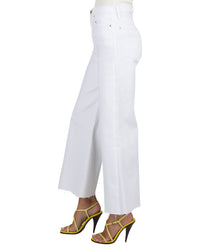 White pants worn by a person on a white background