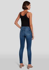 Back of the high waisted skinnys by 7 For All Mankind, paired with a black tank and nude, heeled slides.