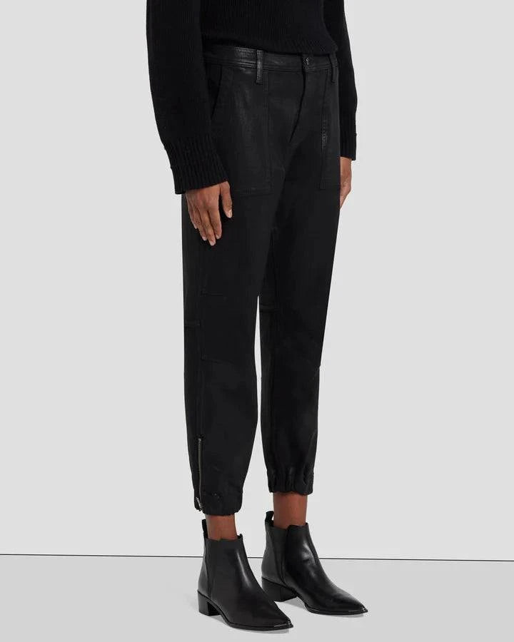 Close-up view of the front of the 7 For All Mankind Darted Boyfriend Jogger, highlighting the darted knee details, coated denim finish, and elasticized waistband with exposed zipper closure.