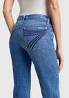 Close-up of the back of the 7 For All Mankind Dojo Tailorless jeans, highlighting the signature 7 back pocket and sculpting fit in medium blue denim.