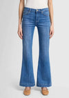 Close-up of the 7 For All Mankind Dojo Tailorless jeans in medium blue, showcasing the front waist and relaxed fit with the signature 7 back pocket.
