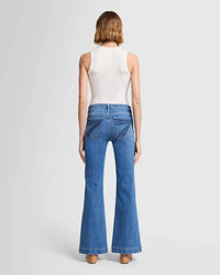 Full back view of the 7 For All Mankind Dojo Tailorless jeans, emphasizing the relaxed leg, sculpting fit, and the signature 7 back pocket.