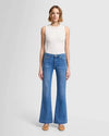 Full front view of the 7 For All Mankind Dojo Tailorless jeans in medium blue, showing the fitted hips, relaxed leg, and wide trouser cuff for a stylish, comfortable look.