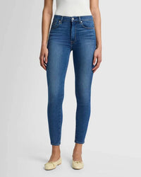 Close-up view of the 7 For All Mankind High Rise Ankle Skinny jeans, showing the high-rise waist and smooth, sculpted fit in a classic blue wash.