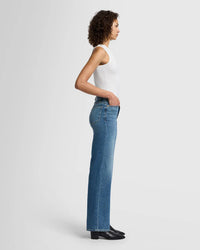 Side view showing the wide leg and high rise fit of the Jo jeans in Sea Level blue.