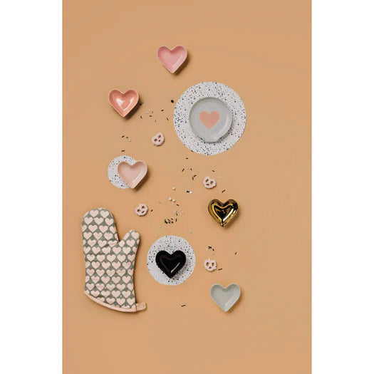 A stylish flat lay of six theme-shaped stoneware pinch bowls, surrounded by spices and seasonings on a minimalist kitchen surface.