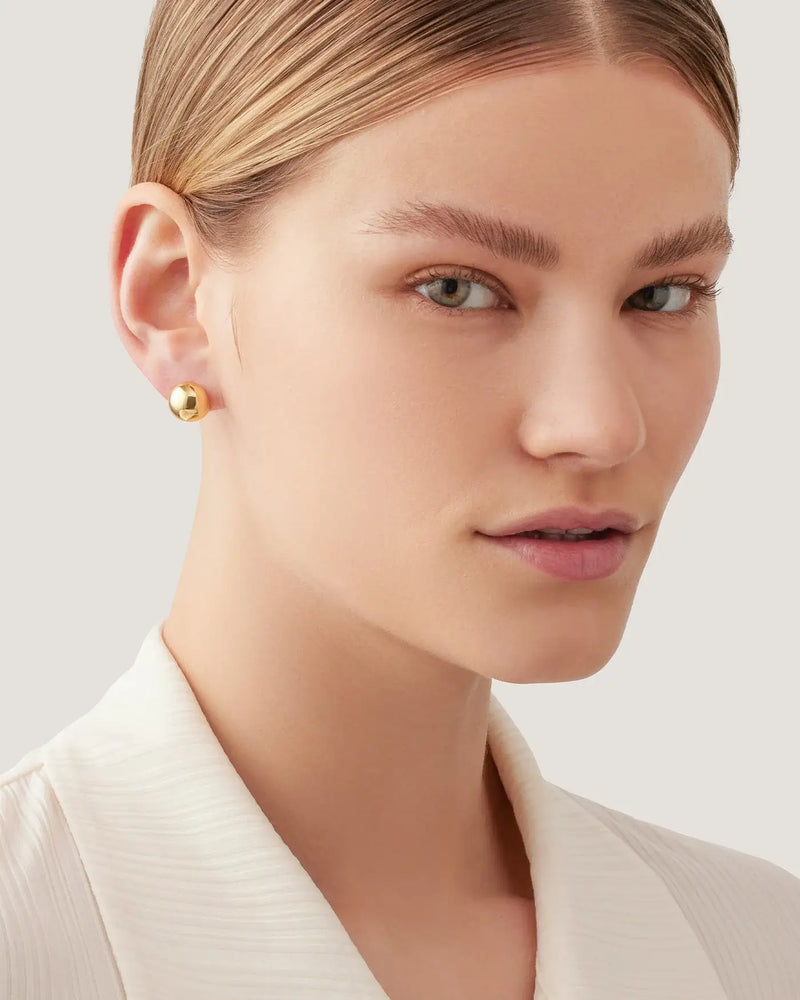 Model wearing the Aurora Stud Earrings in-store at Lemonberry, Aurora boutique clothing store.