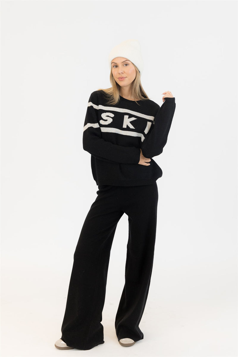 Styled with white beanie for winter-ready look, photographed in studio