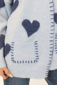Close-up of the heart motif and pocket whipstitch details