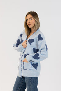 Side angle showing front and pocket detailing on the cardigan