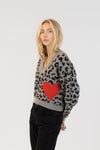 Side view of the Elska cardigan showing full heart pattern and relaxed fit