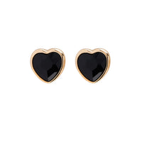 A pair of Foxy Originals Freya Earrings featuring heart-shaped black stones set in a 14K gold-plated fine pewter border. Handmade in Canada.