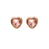 A pair of Foxy Originals Freya Earrings featuring heart-shaped rose-colored stones set in a 14K gold-plated fine pewter border. Handmade in Canada.