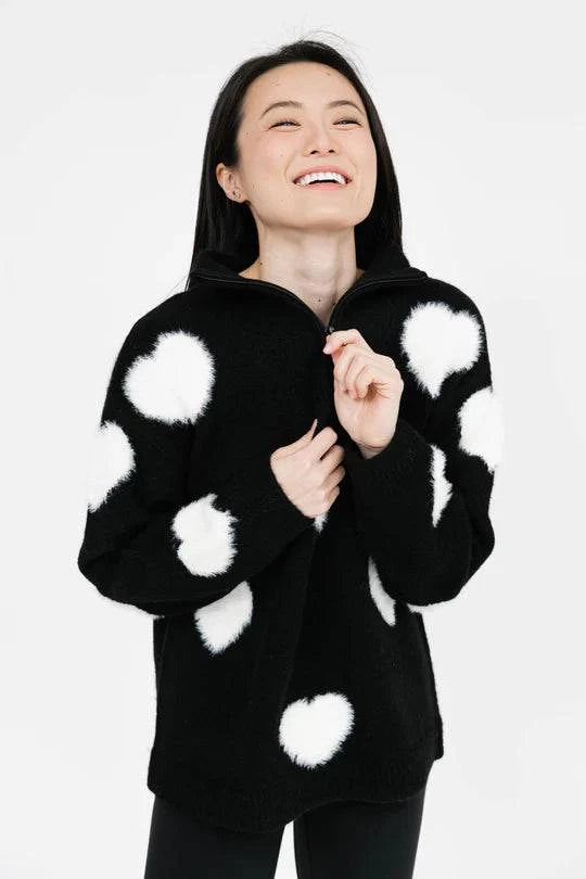 Another view of the Galentine's Day Sweater in black and white, highlighting its cozy fit, festive design, and relaxed comfort, perfect for celebrating with friends.