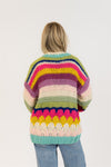 Back view of rainbow knit cardigan with thick rows of bright colour