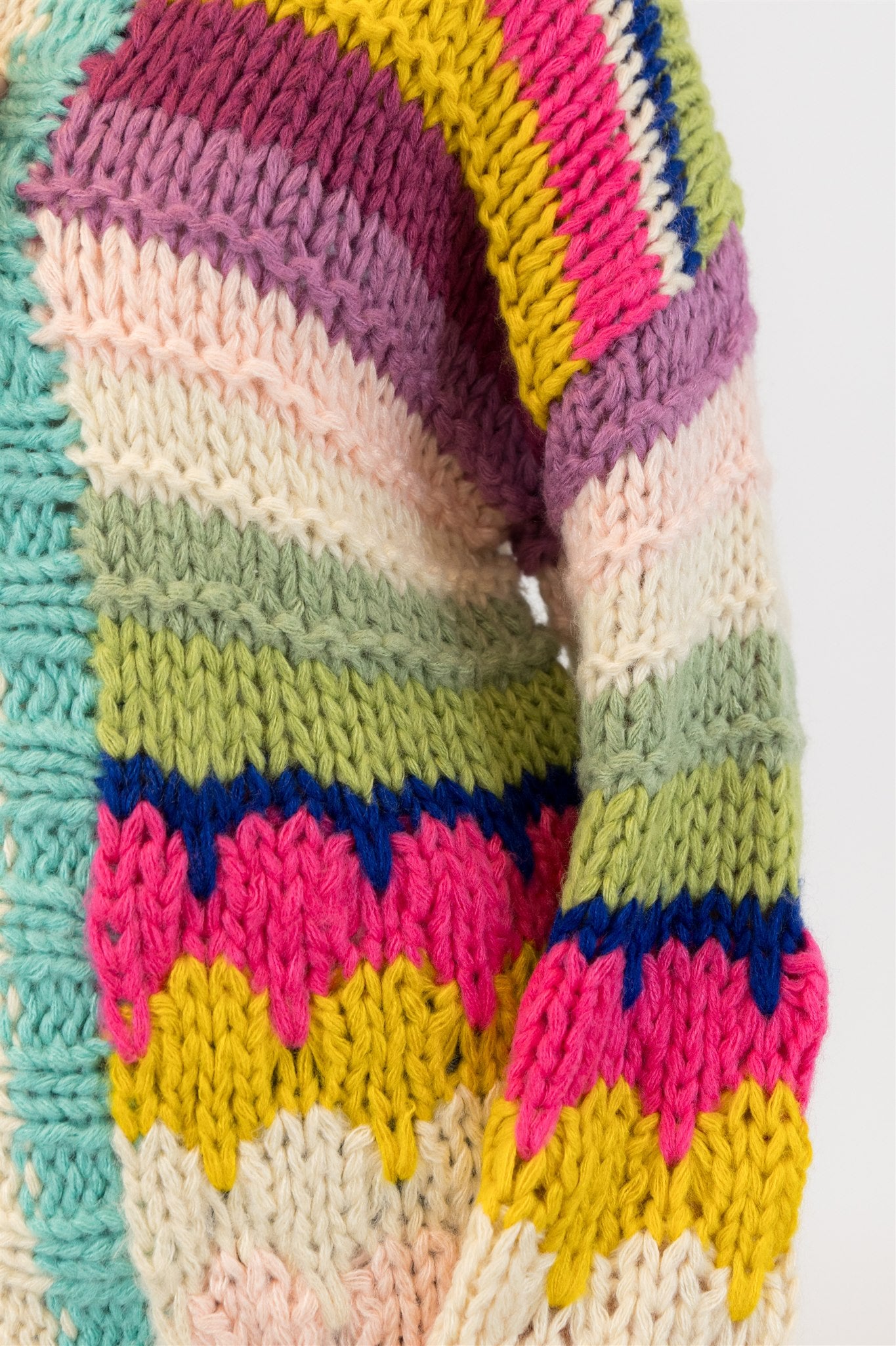 Close-up of the sleeve knit texture and colour detailing on the Haven Cardigan