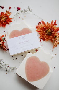 Handcrafted heart-shaped soap bar, perfect for Valentine's Day, featuring natural ingredients and eco-friendly packaging.
