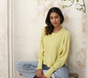 Model wearing the yellow Sailing sweater by Echo Verde