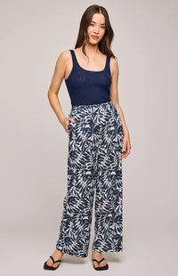 Model wearing Adelaide trousers by Gentle Fawn in blue and white leafy cotton print – available at Lemonberry, Aurora ON