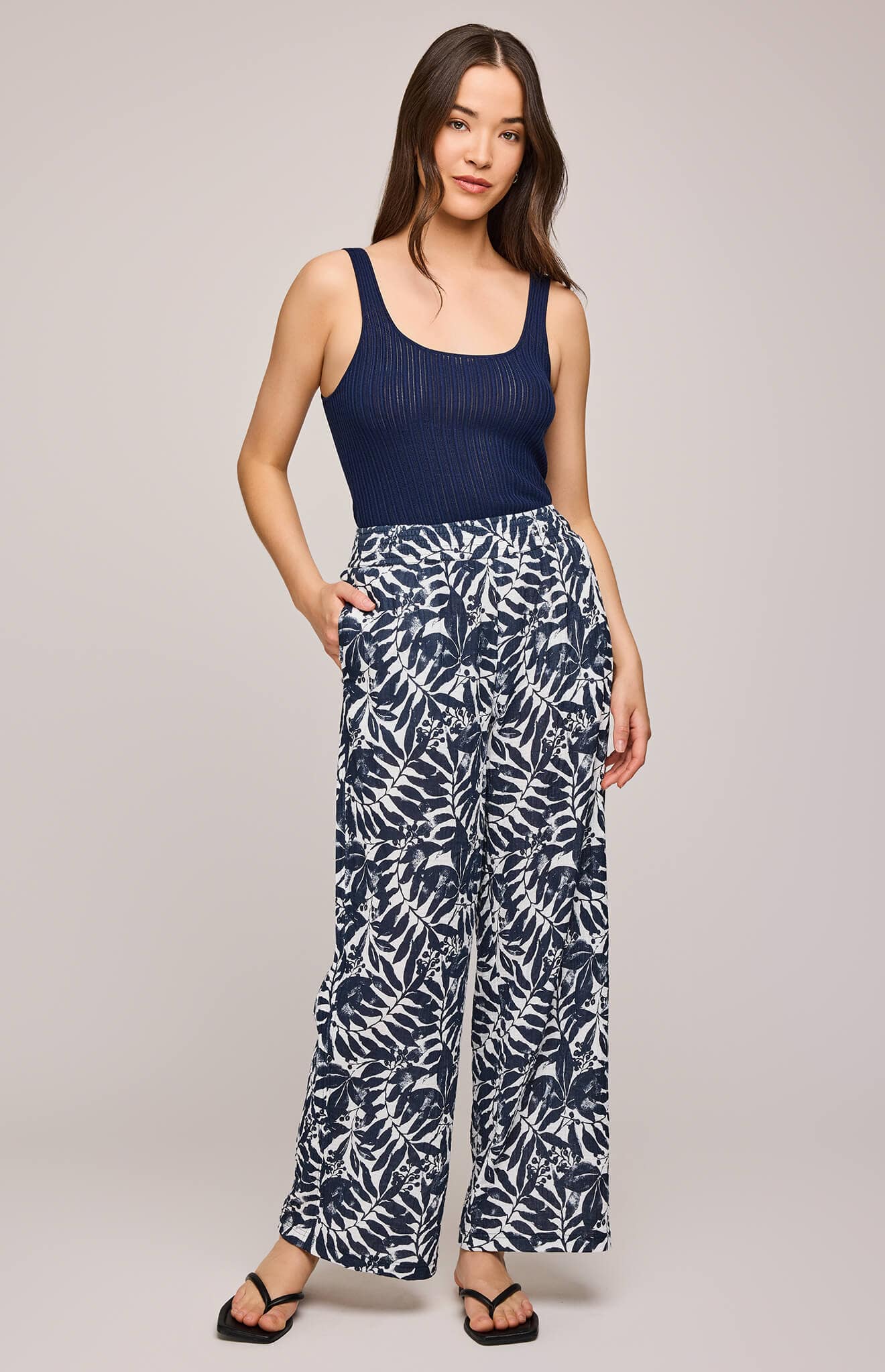 Model wearing Adelaide trousers by Gentle Fawn in blue and white leafy cotton print – available at Lemonberry, Aurora ON