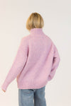 Back view of Lyla & Luxe Aggie turtleneck sweater in pink mix
