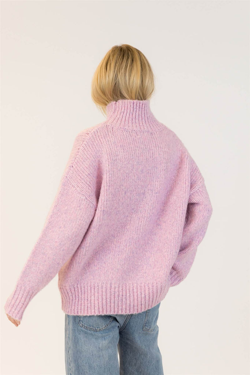 Back view of Lyla & Luxe Aggie turtleneck sweater in pink mix