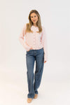 Styled look with Aisha Crystal sweater in pink paired with denim