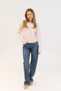 Styled look with Aisha Crystal sweater in pink paired with denim