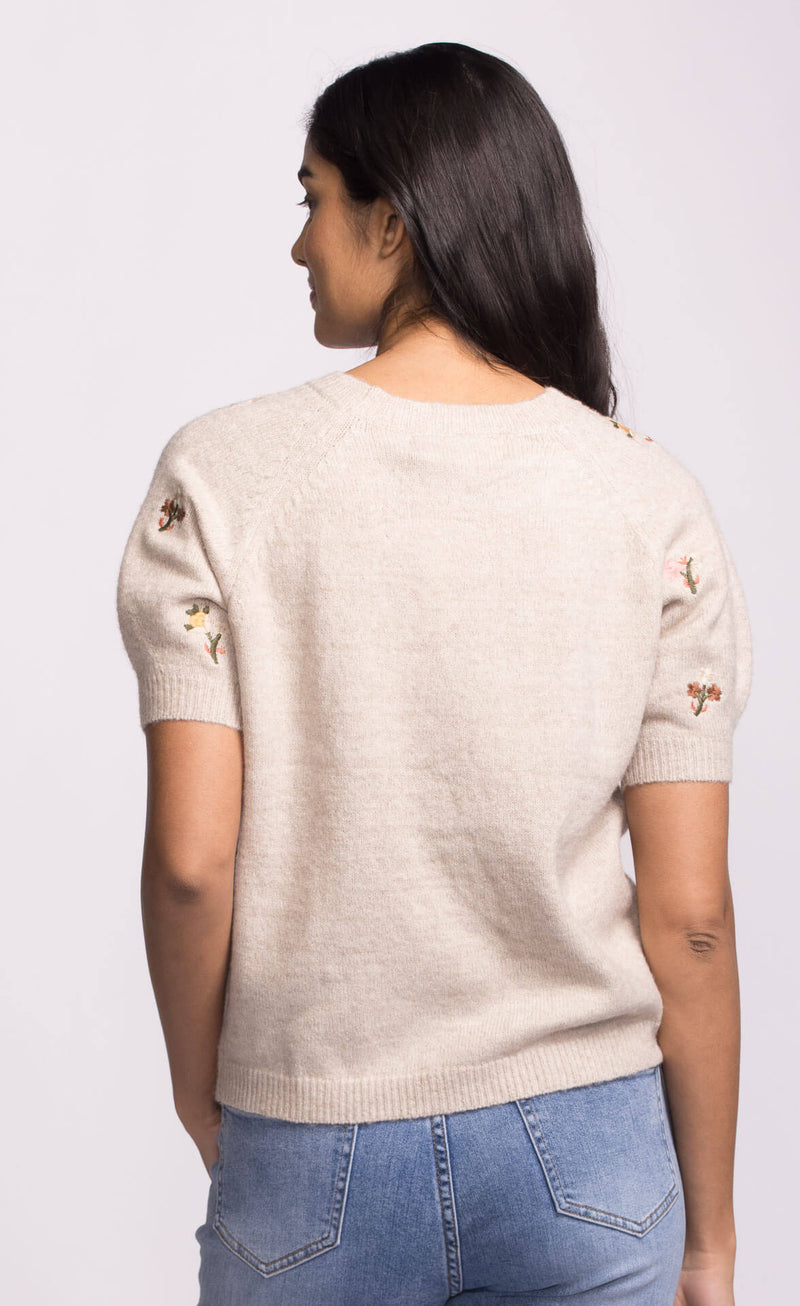 Back view of Alva Sweater showing embroidered floral accents on sleeves, Lemonberry Pink Martini collection.