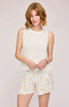 Model wearing the Andra Tank in White, a classic sleeveless knit top with a flattering crew neckline, available at Lemonberry, Aurora, ON.