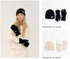 Woman wearing black Lyla + Luxe Apres Heart beanie and gloves with heart detail