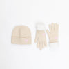 Beige knit hat and gloves set with pink hearts on a white background