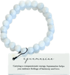 Aquamarine bracelet on a white background with descriptive card