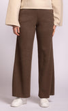 Wide-leg brown knit pants by Pink Martini, photographed front-on with cream sweater and white sneakers, available at Lemonberry just north of Richmond Hill.
