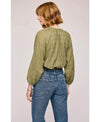 Back side of the Gentle Fawn Atlas Blouse in Matcha, showing the detail in the fabric along with its stylish flowy nature.
