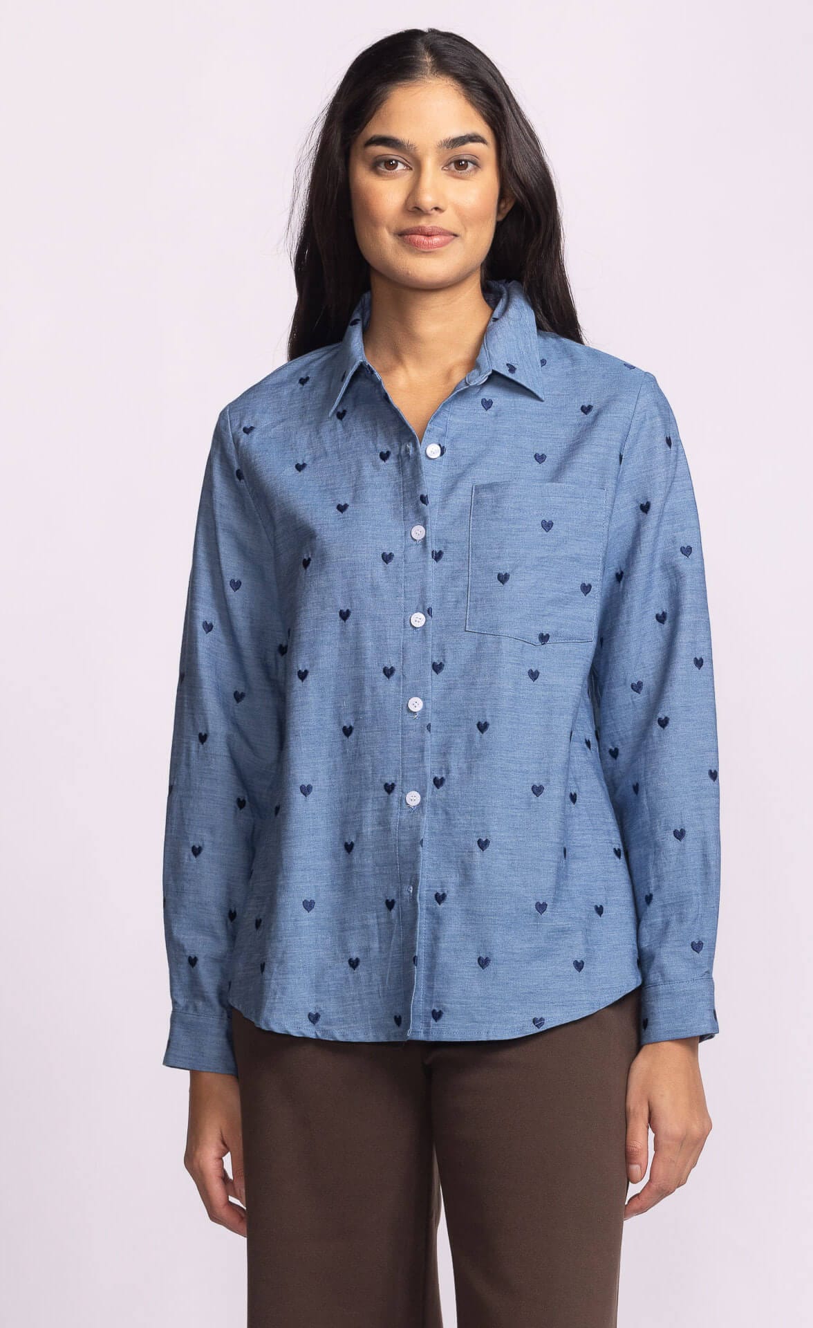 Azula Top by Pink Martini – blue cotton button-down shirt with embroidered navy hearts, front view, available at Lemonberry in Aurora