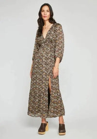 Side pose of Gentle Fawn Beatrice Dress fabric showing chiffon texture and lurex stripe