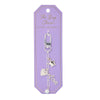 Silver Bella Bag Charm by Foxy Originals on lavender backing card with gold text