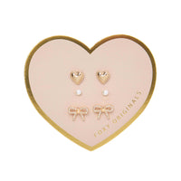 Bella Mix & Match Earrings by Foxy Originals – gold heart, pearl, and pavé bow studs displayed on heart-shaped card packaging